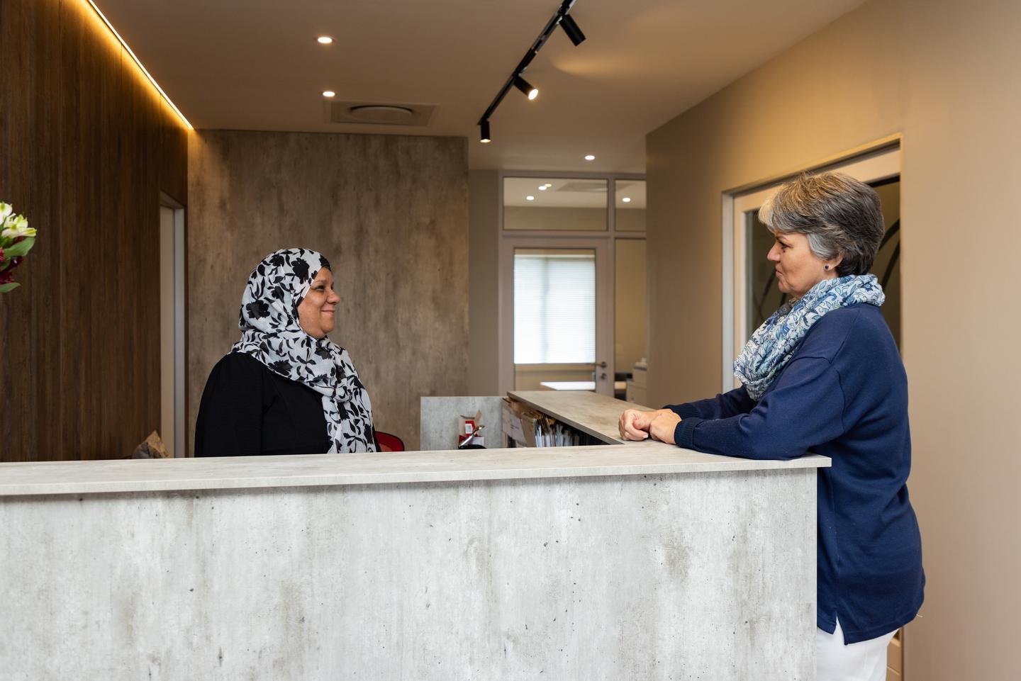 A client being welcomed at reception, Cedar House